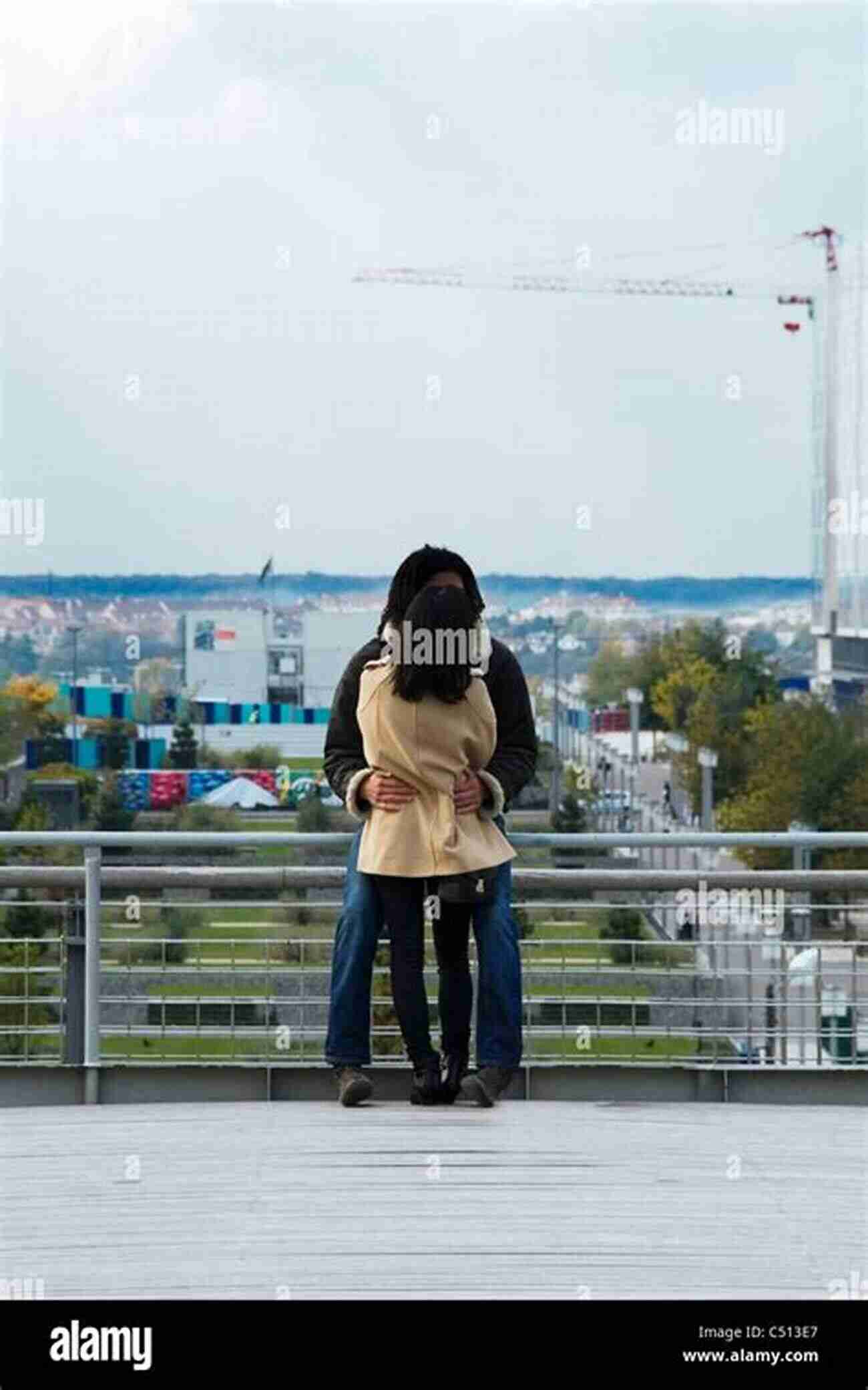 Couple In Love, Embracing On A Scenic Rooftop Terrace Overlooking A City Loving An Alien: How Does It Feel To Fall For A Foreigner?