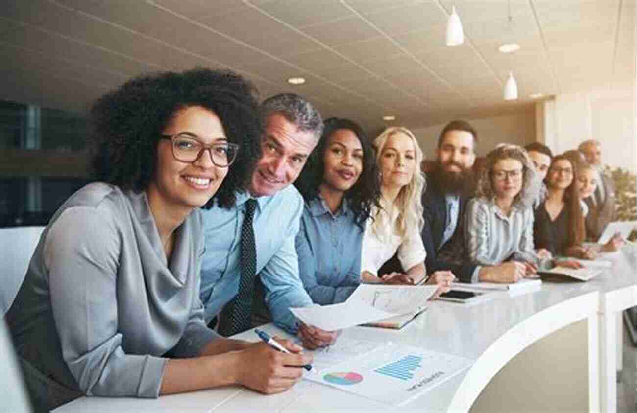 Happy Employees Collaborating In A Modern Office Sustaining Workforce Engagement: How To Ensure Your Employees Are Healthy Happy And Productive