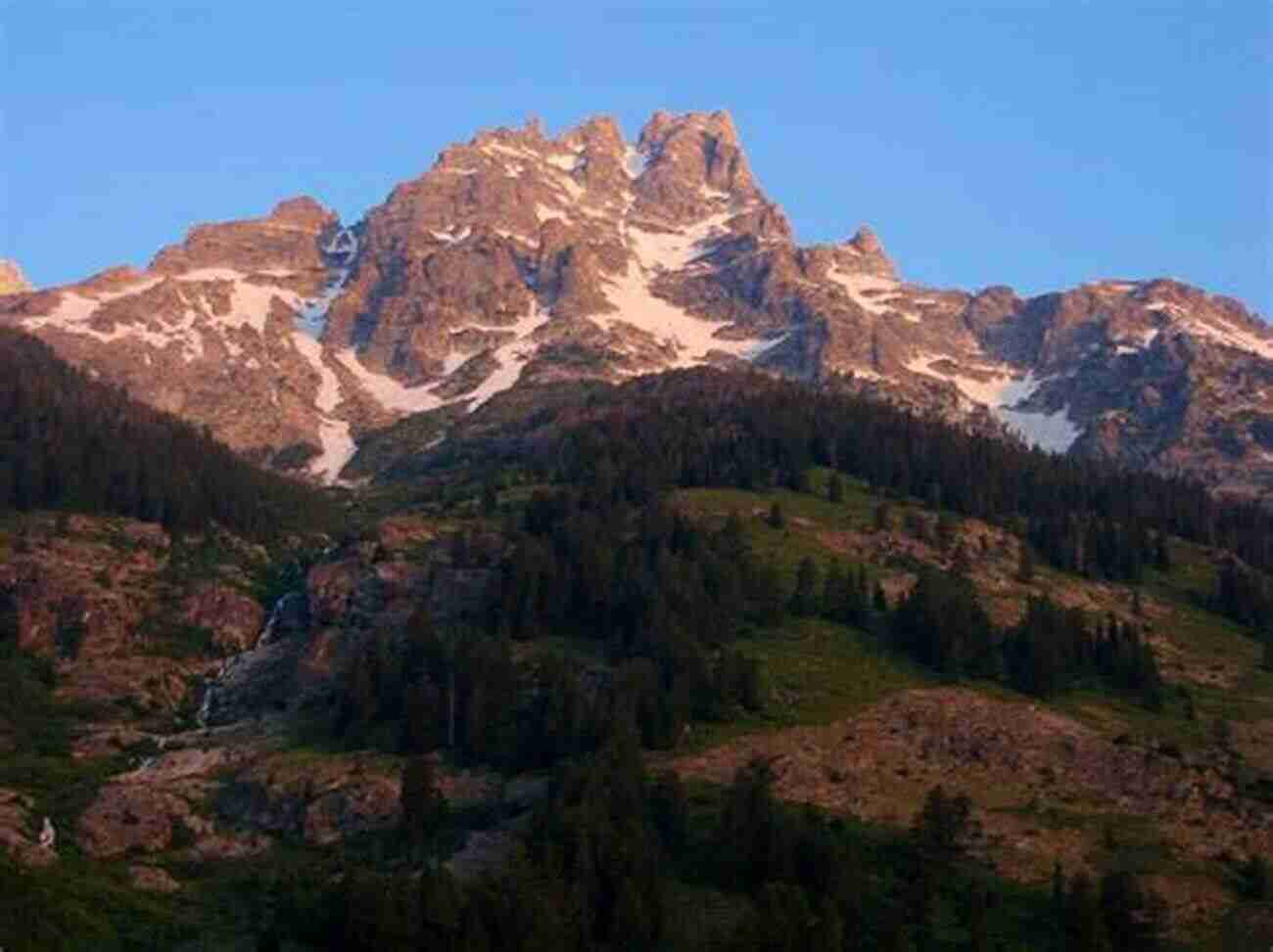 Teewinot Mountain At Sunrise, A Breathtaking View Of Nature's Masterpiece Teewinot: A Year In The Teton Range