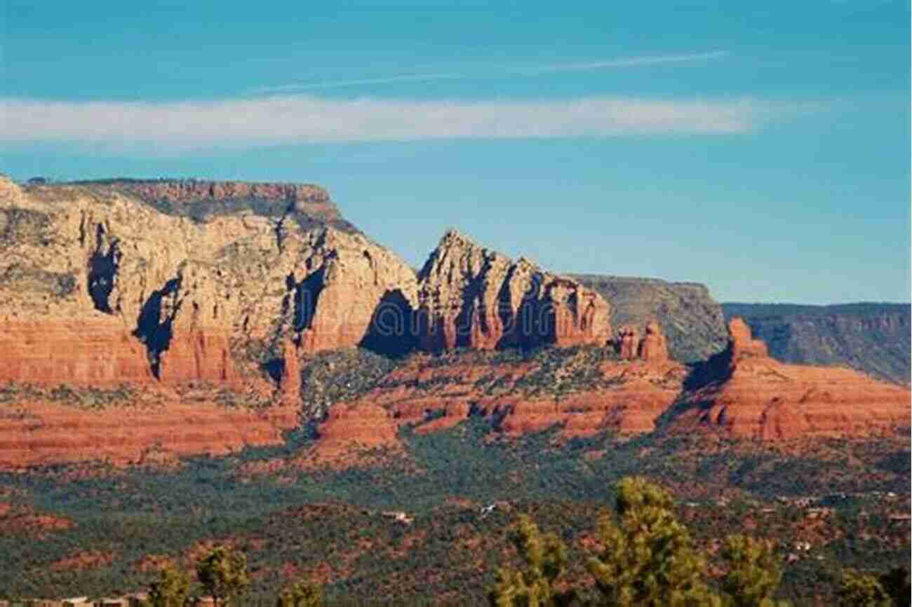 Majestic Red Rocks Standing Tall, A Mesmerizing Sight The Call Of The Canyon